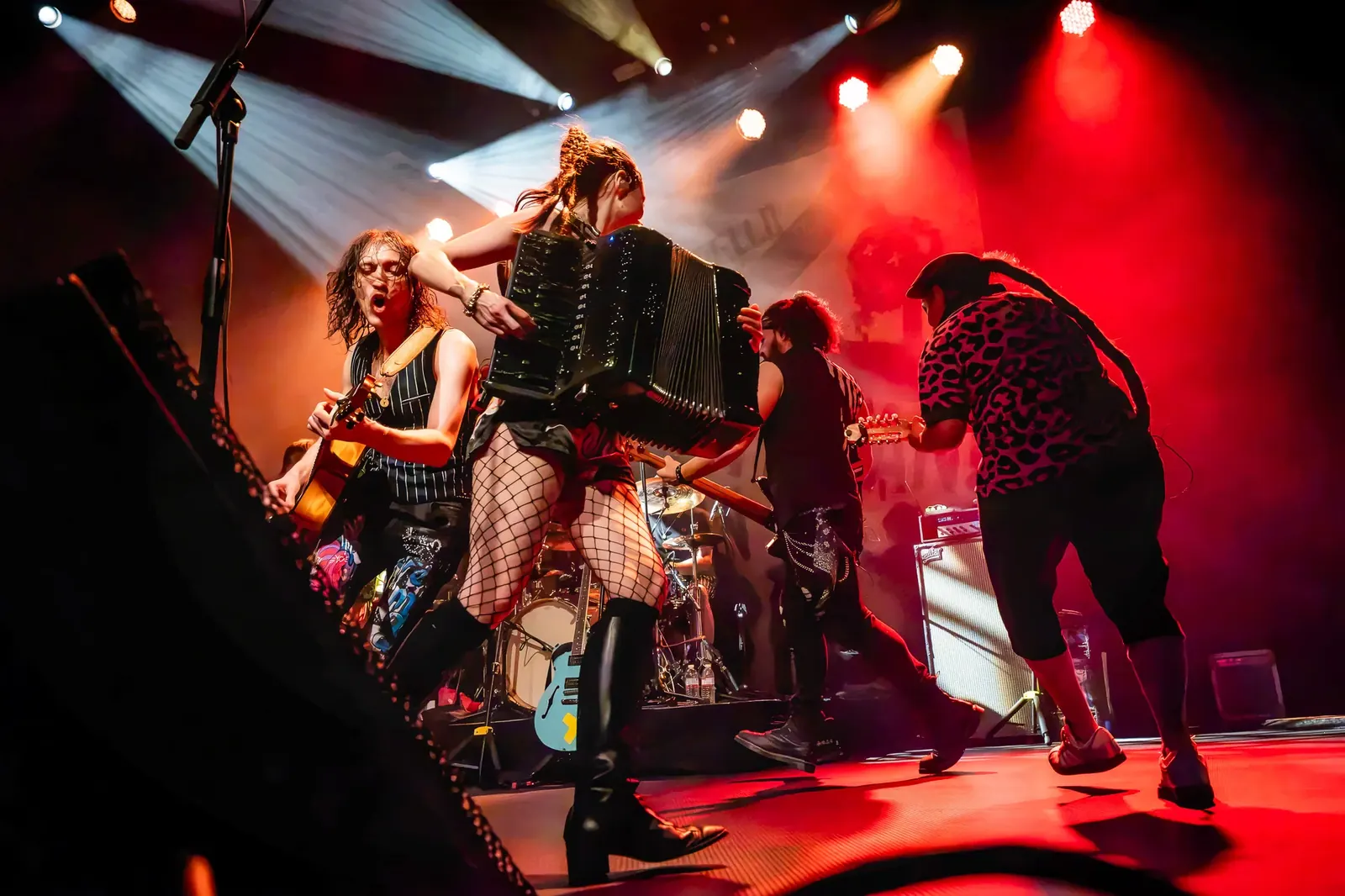 Accordion player and band during a live performance