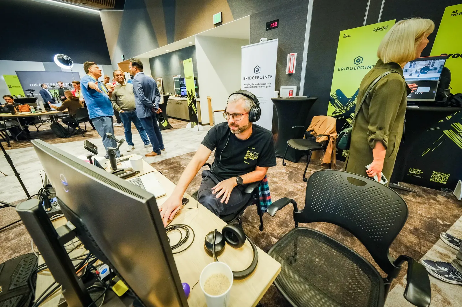 Operator wearing headphones at the production workstation