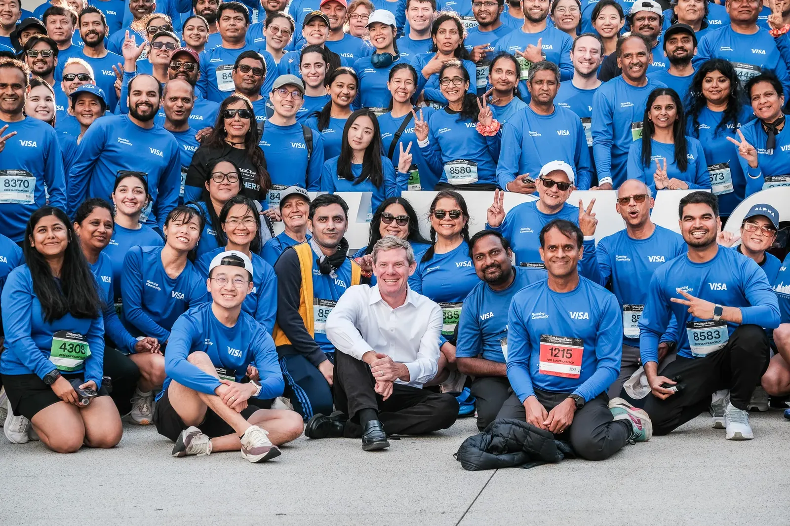 Large group of event participants posing for a photograph
